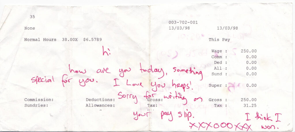 Writing I Love You On Lyssa's Pay Slip