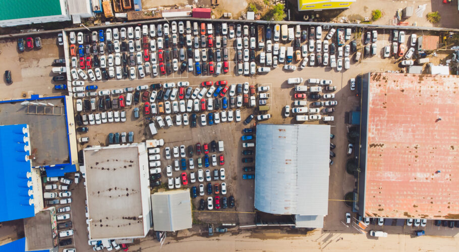 aerial photo small temporary car lot store new cars resale car dealers who have free space storage high altitude top down view