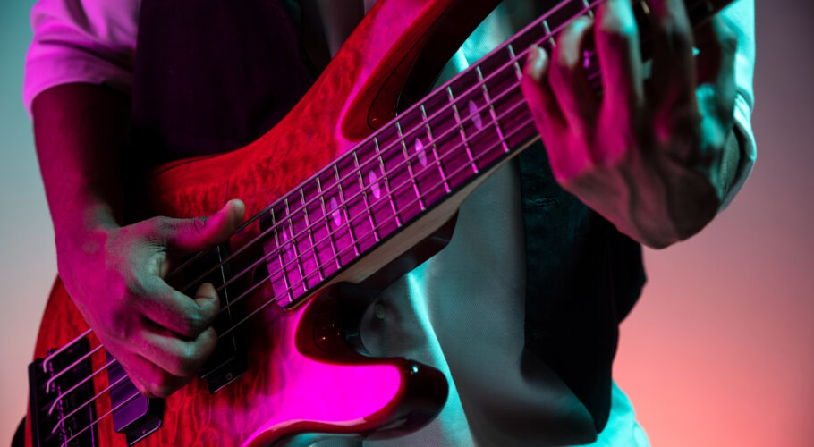african american handsome jazz musician playing bass guitar studio young joyful attractive guy improvising