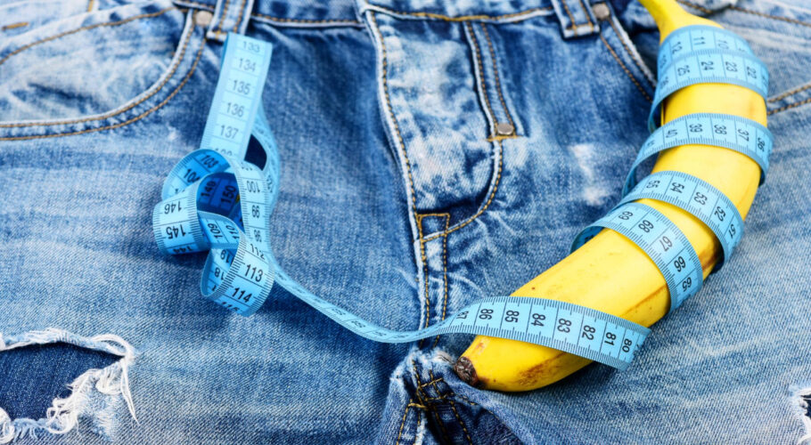 banana wrapped with blue measure tape jeans crotch
