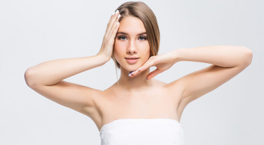 beautiful young girl madlyn with smooth skin light wall with natural make up