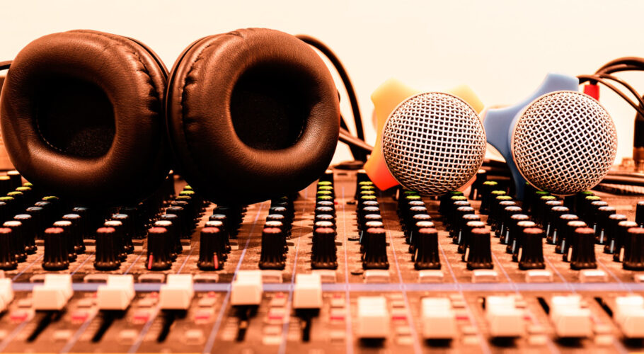black headphone two microphone console sound board mixer