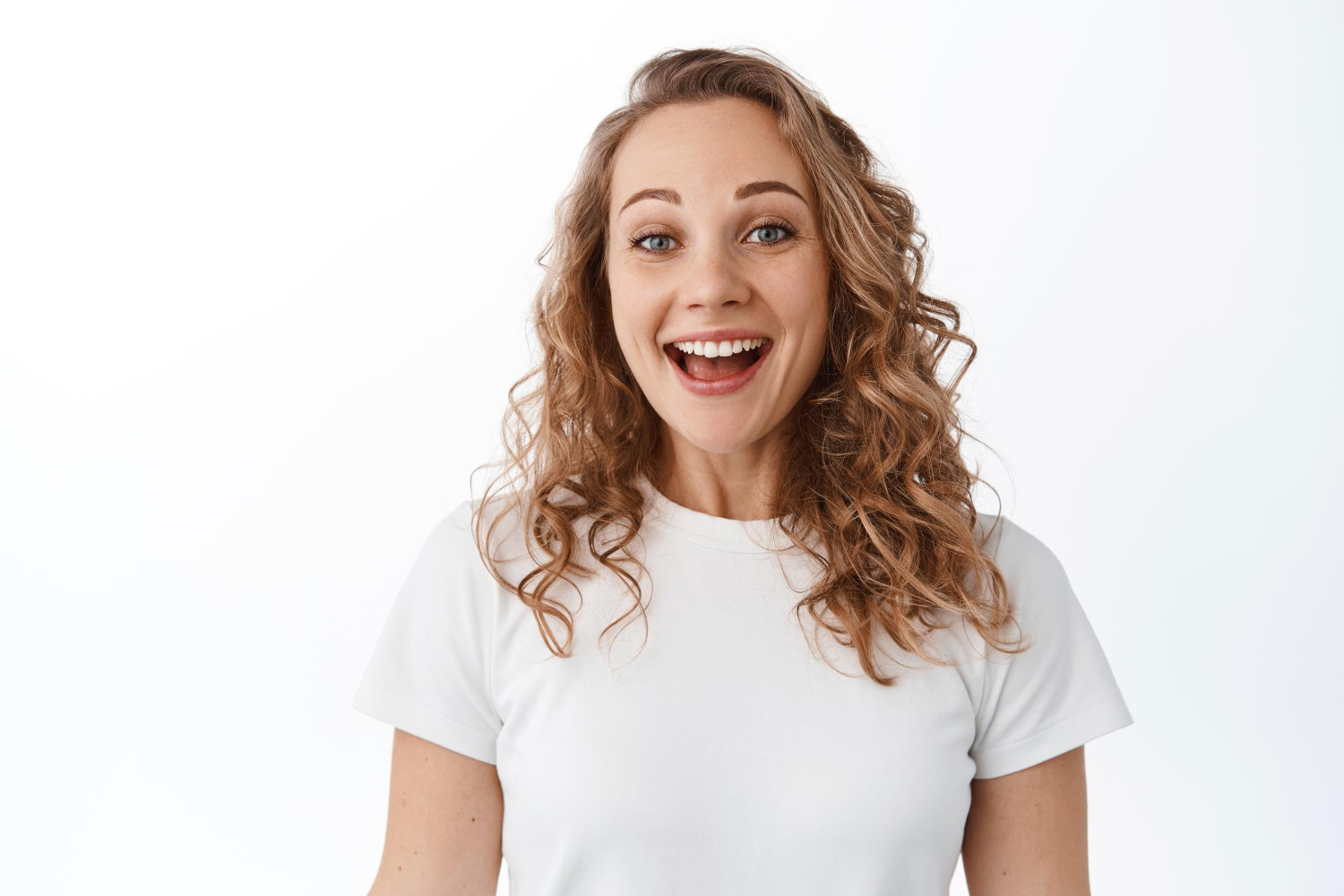 close up excited blond woman smiling pleased looking with joy gratitude standing tshirt