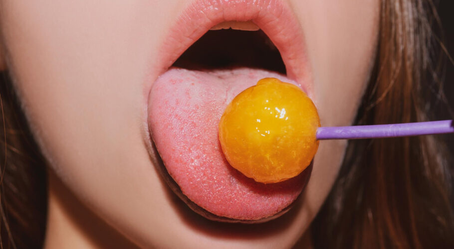 close up lips with lollipop isolated sexy blowjob sensual mouth with lipstick eats sweets sexy design women girls beauty lips