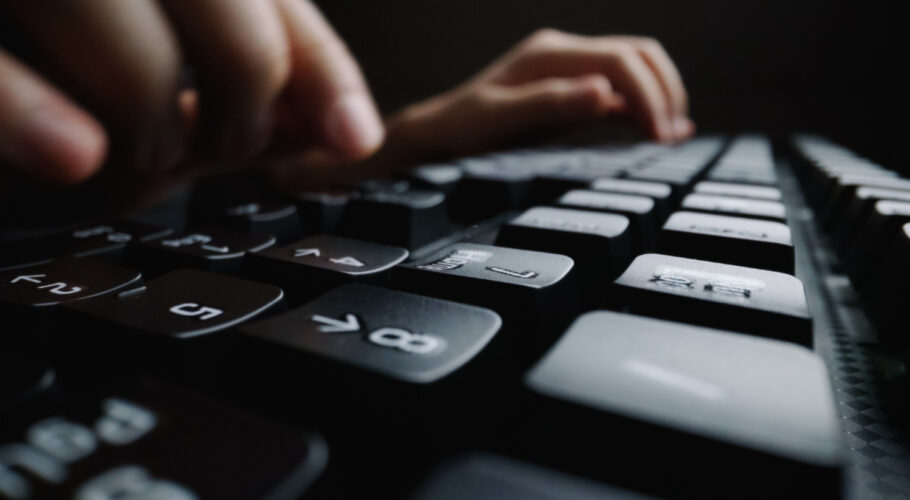 close up soft focus finger typing keyboard