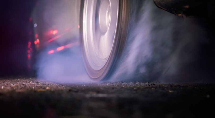 drag racing car burning tire starting line race track