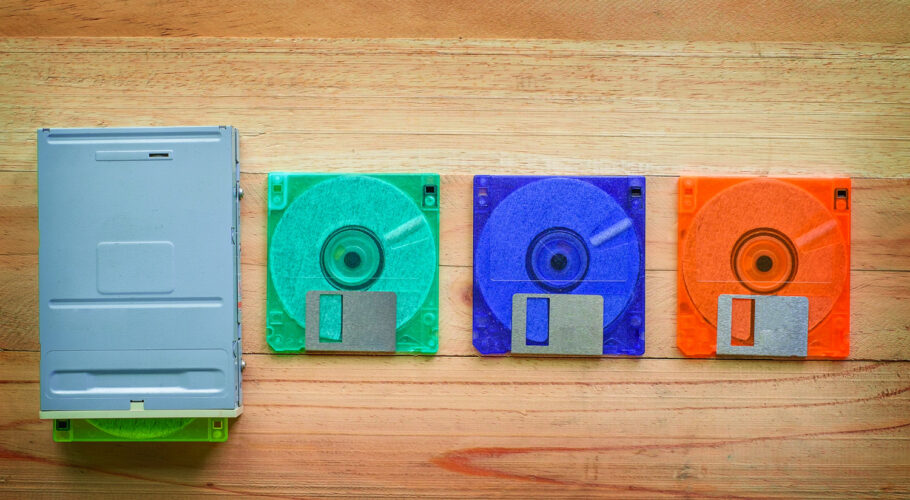 floppy disk drive diskettes wooden table dos to dos