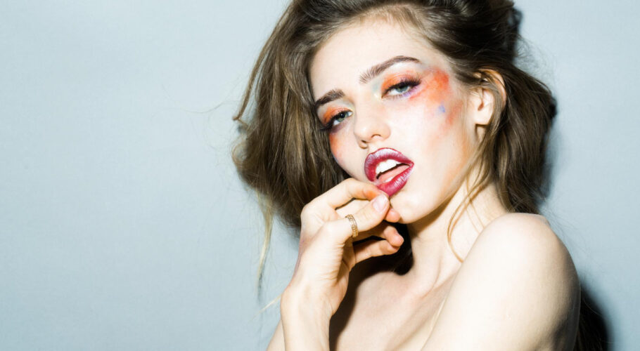 girl with orange makeup closeup