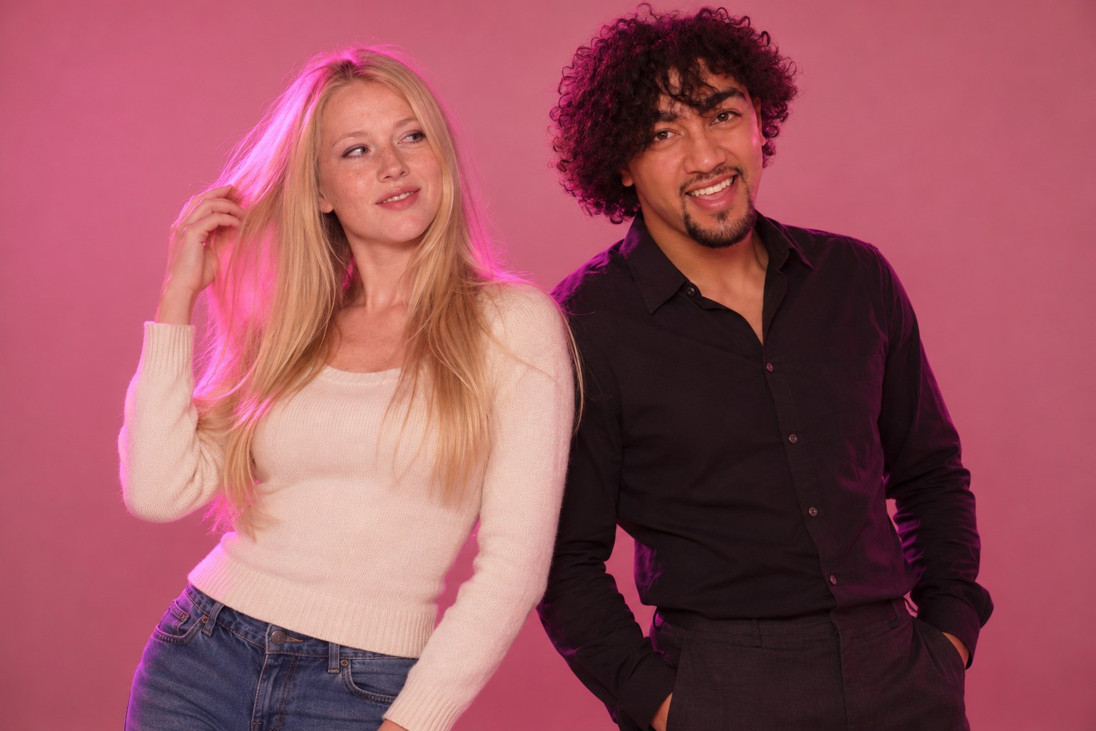 A young woman and a young man with long glossy hair pose side by side like models, studio photograph in the style of 1999 Sydney