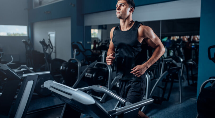 male athlete workout running exercise treadmill machine active sport training in the gym