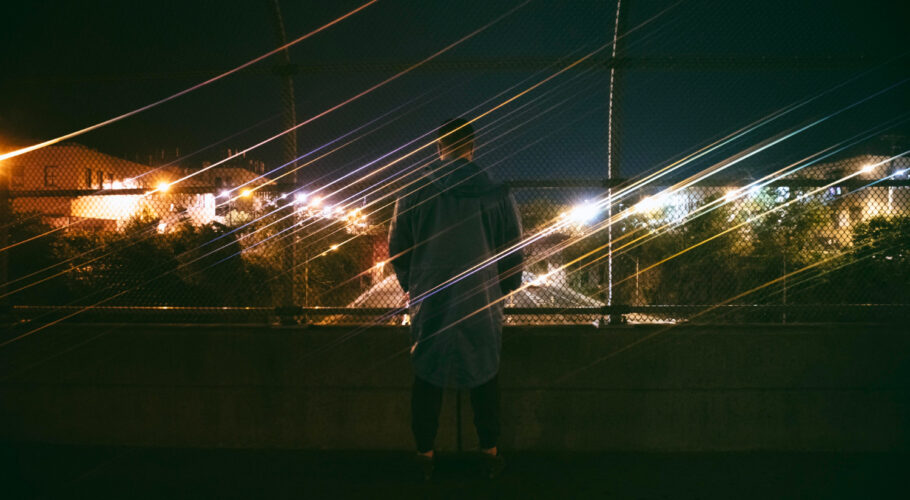 man outdoors city night