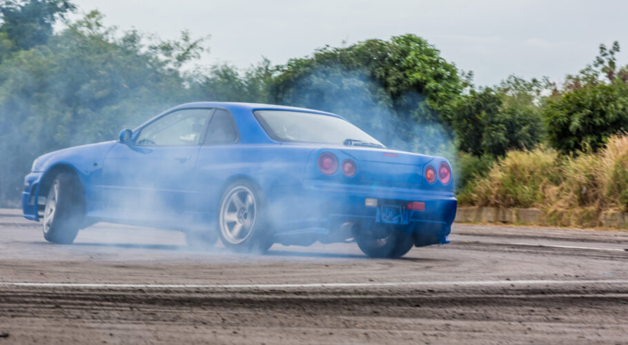 motion blur car drifting professional driver drifting car race track with smoking