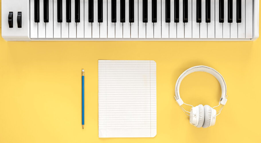 musical flat lay background with headphones musical keys create write music