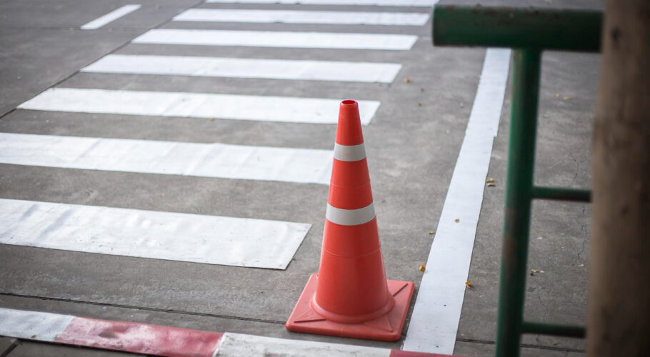 orange traffic cones cement road surface