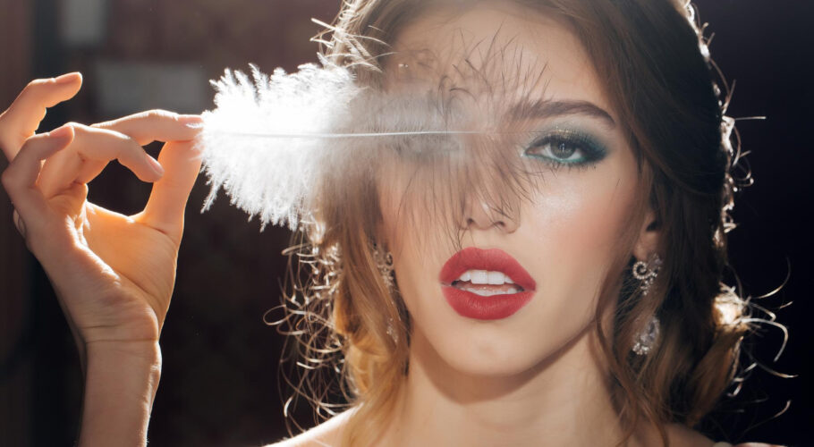 pretty woman lyssa with feather closeup