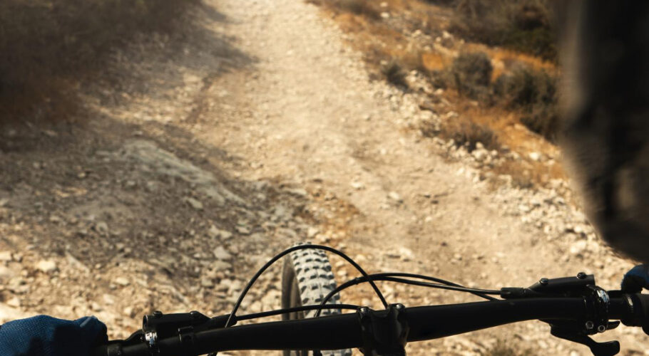 professional mtb bike rider during downhill ride his bicycle mountains