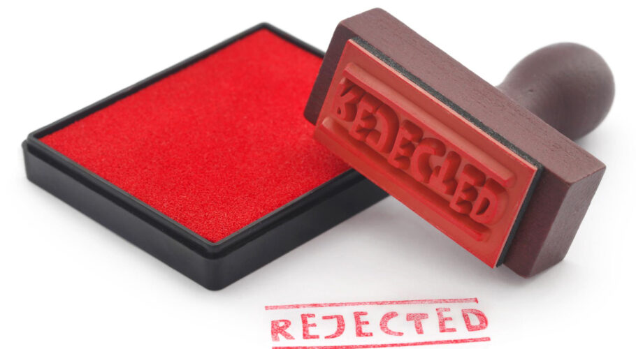 rejected rubber stamp with pad on white background