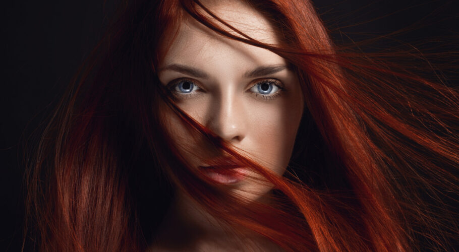 Young beautiful long-haired redhead girl in Macarthur Square