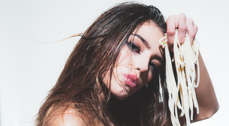 sexy woman eating spaghetti