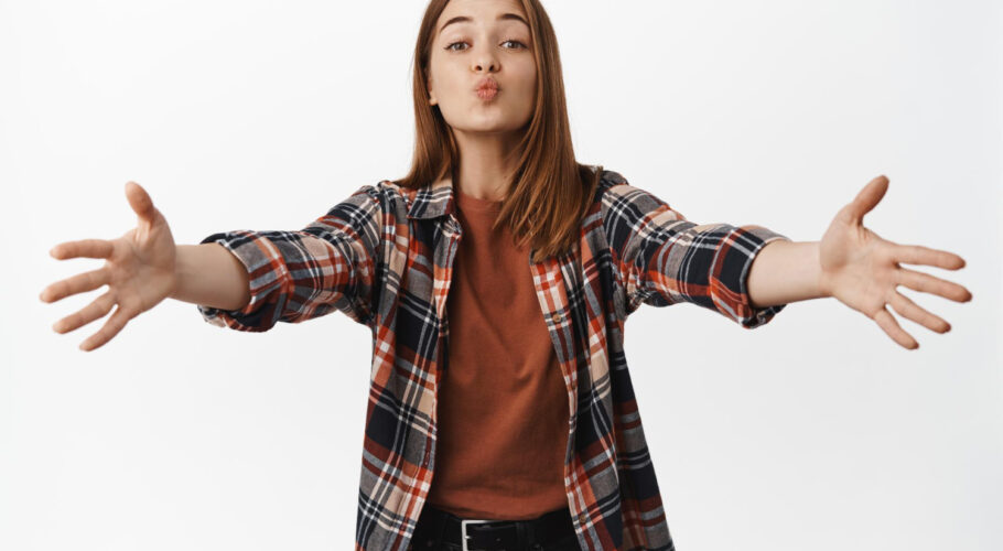 silly cute girl reaching kiss hugs stretching out hands pucker lips