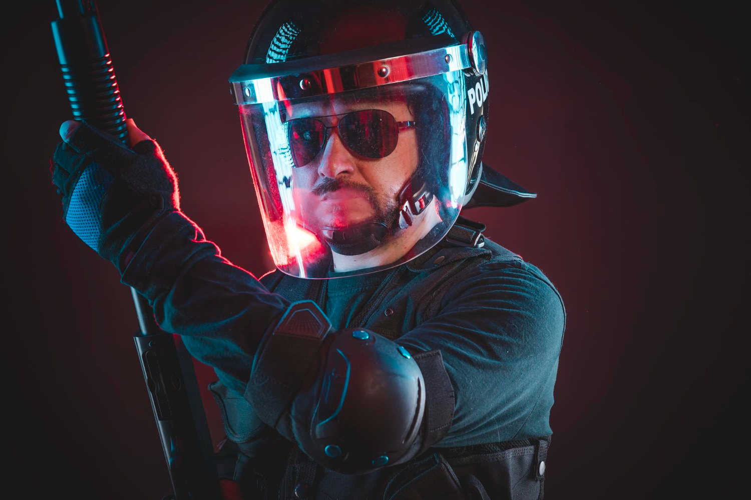 special riot police with red hazard lights armed man with helmet bulletproof vest