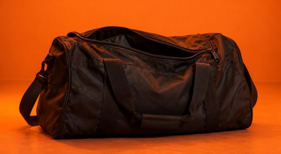 Half zipped black sports bag in orange light