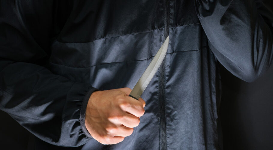 killer person with sharp knife about to commit homicide
