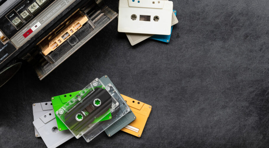 top view retro radio colorful cassette tape black floor