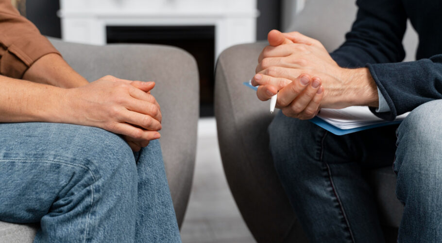 woman counselor holding hands together