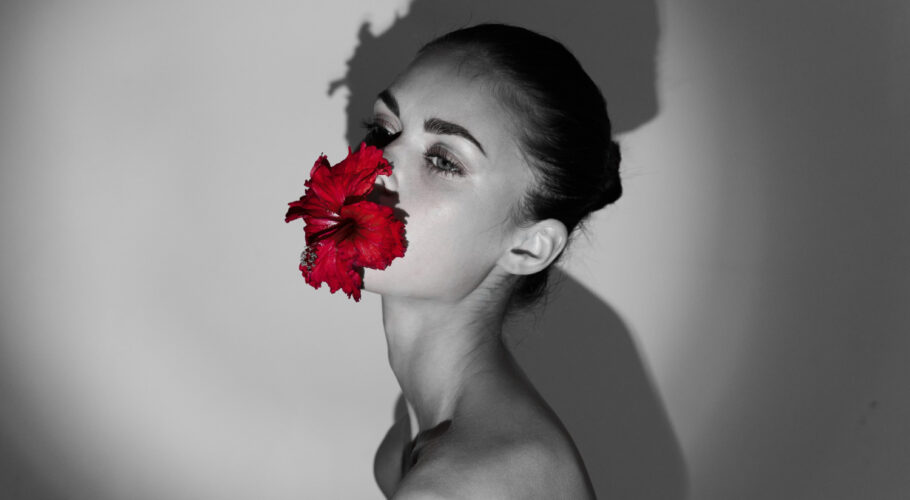 phoenix woman naked shoulders red flower her mouth black white photo