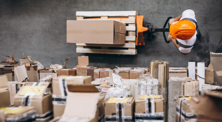 young man working warehouse with boxes